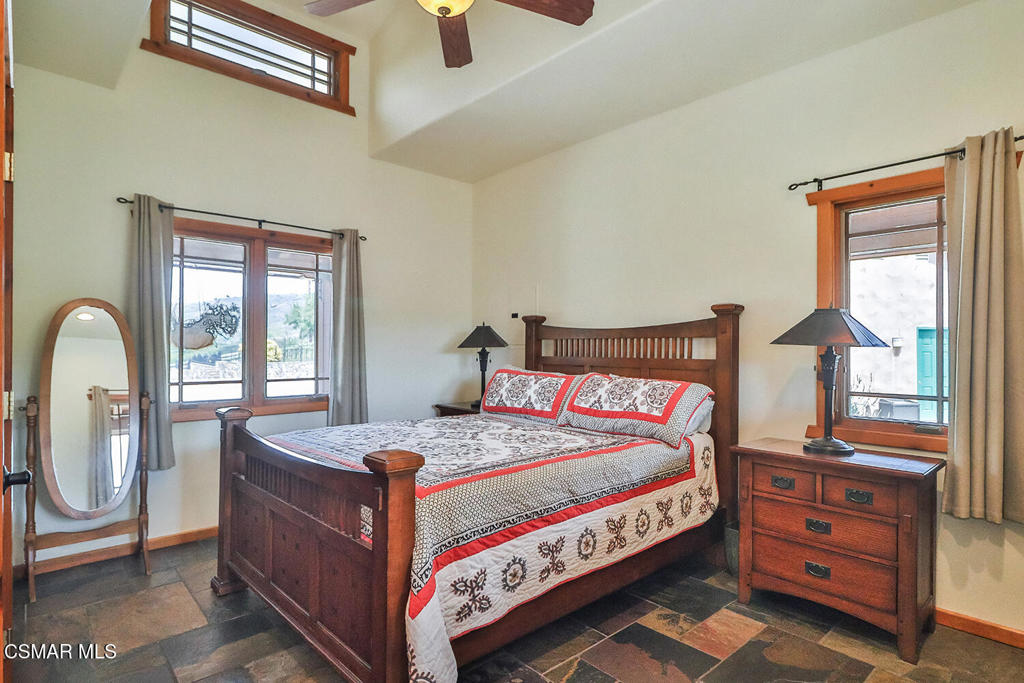 3030 Triunfo Canyon Road Agoura Hills, CA 91301 - Photo 39 of 50 a bedroom with a bed and a dresser