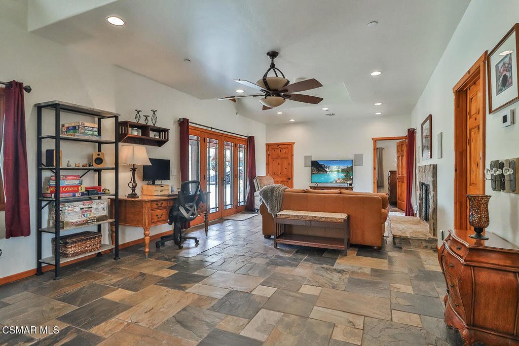 3030 Triunfo Canyon Road Agoura Hills, CA 91301 - Photo 41 of 50 a bedroom with furniture and a flat screen tv