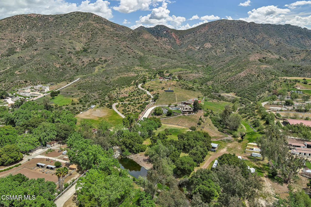 3030 Triunfo Canyon Road Agoura Hills, CA 91301 - Photo 45 of 50 a view of a lush green hillside and houses