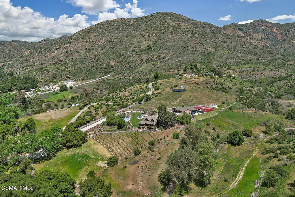 3030 Triunfo Canyon Road Agoura Hills, CA 91301 - Photo 46 of 50 a view of a houses with a yard