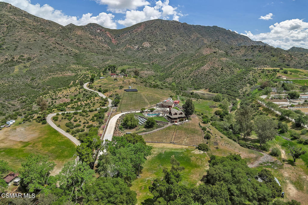 3030 Triunfo Canyon Road Agoura Hills, CA 91301 - Photo 47 of 50 a view of a town with mountains in the background