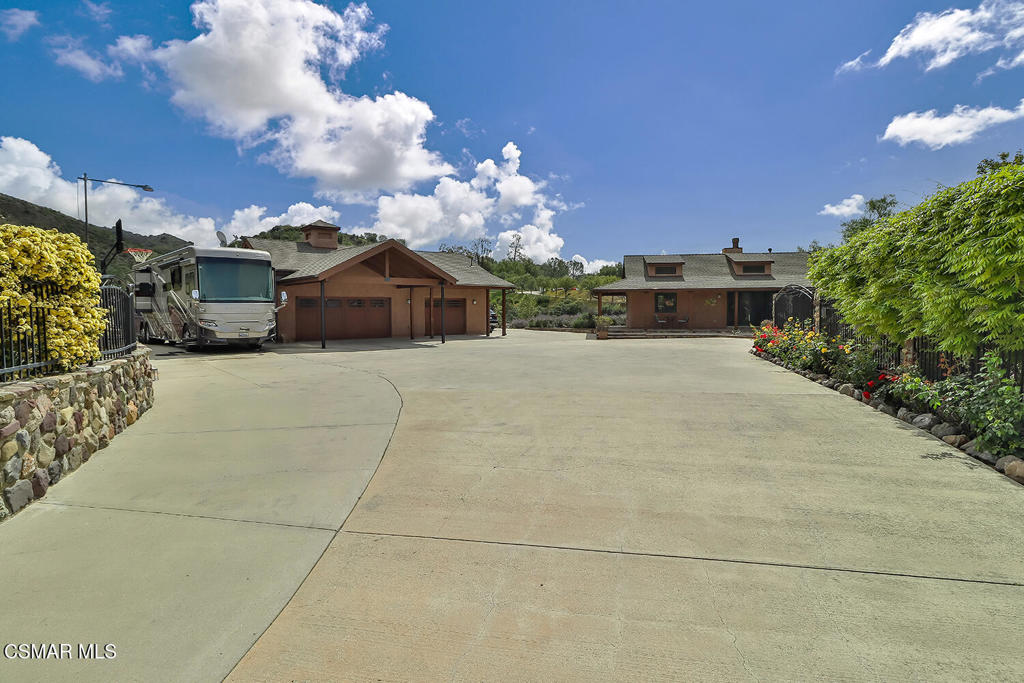 3030 Triunfo Canyon Road Agoura Hills, CA 91301 - Photo 7 of 50 a view of a house with a yard