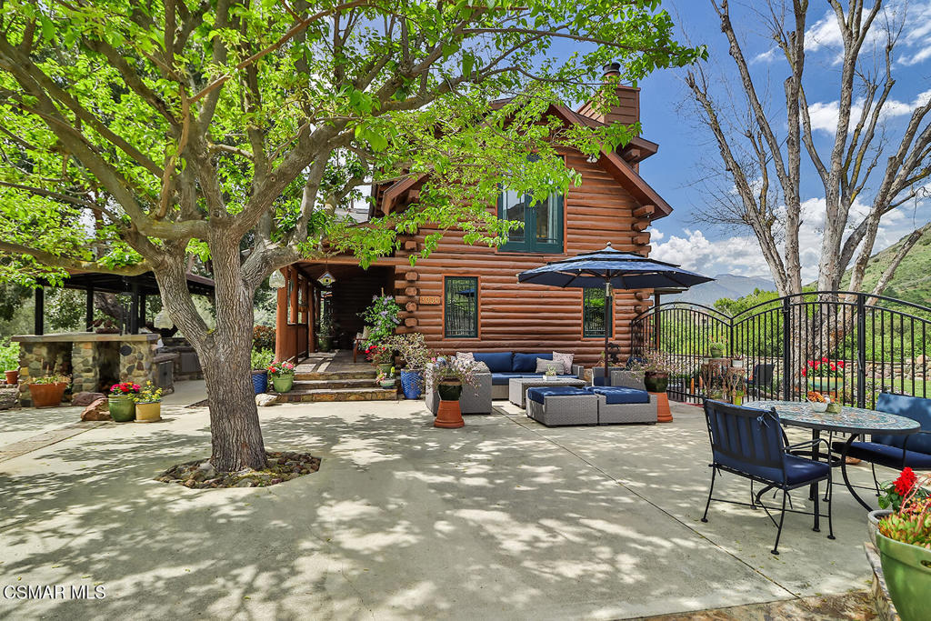 3030 Triunfo Canyon Road Agoura Hills, CA 91301 - Photo 10 of 50 a backyard of a house with fire pit and outdoor seating