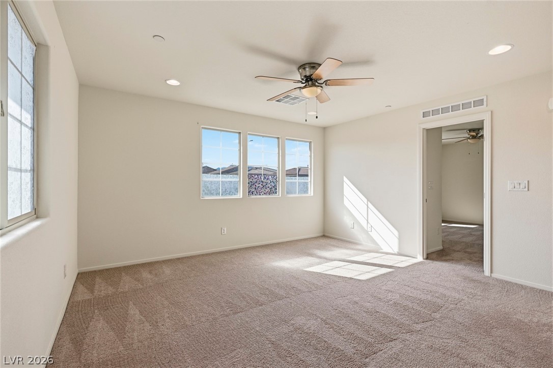 250 Dedication Avenue Henderson, NV 89011 - Photo 37 of 67 Unfurnished bedroom with carpet, a ceiling fan, and recessed lighting