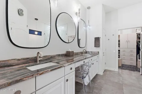 a bathroom with a double vanity sink double and a mirror
