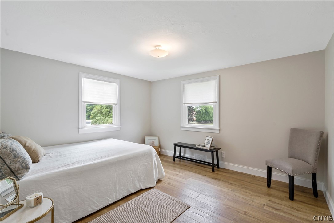 6130 South Bay Road Cicero, NY 13039 - Photo 15 of 30 Heading to the largest of the 3 bedrooms that is situated at the front corner of the home, we find vast space and lots of natural light.