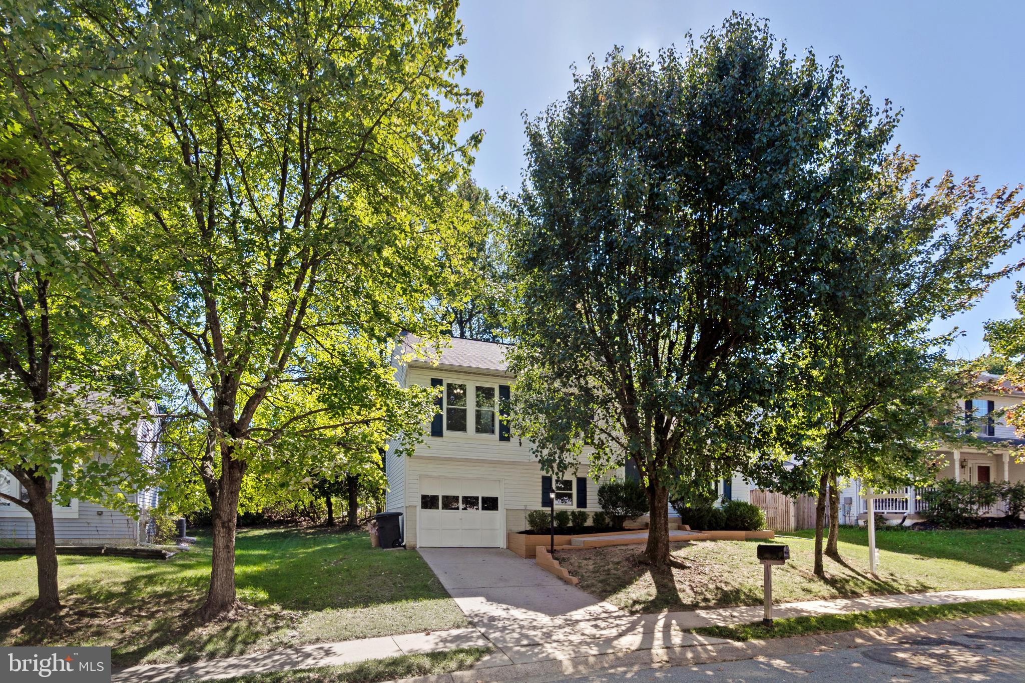 9079 Manorwood Road Laurel, MD 20723 - Photo 2 of 35 a view of a white house with a sink and yard