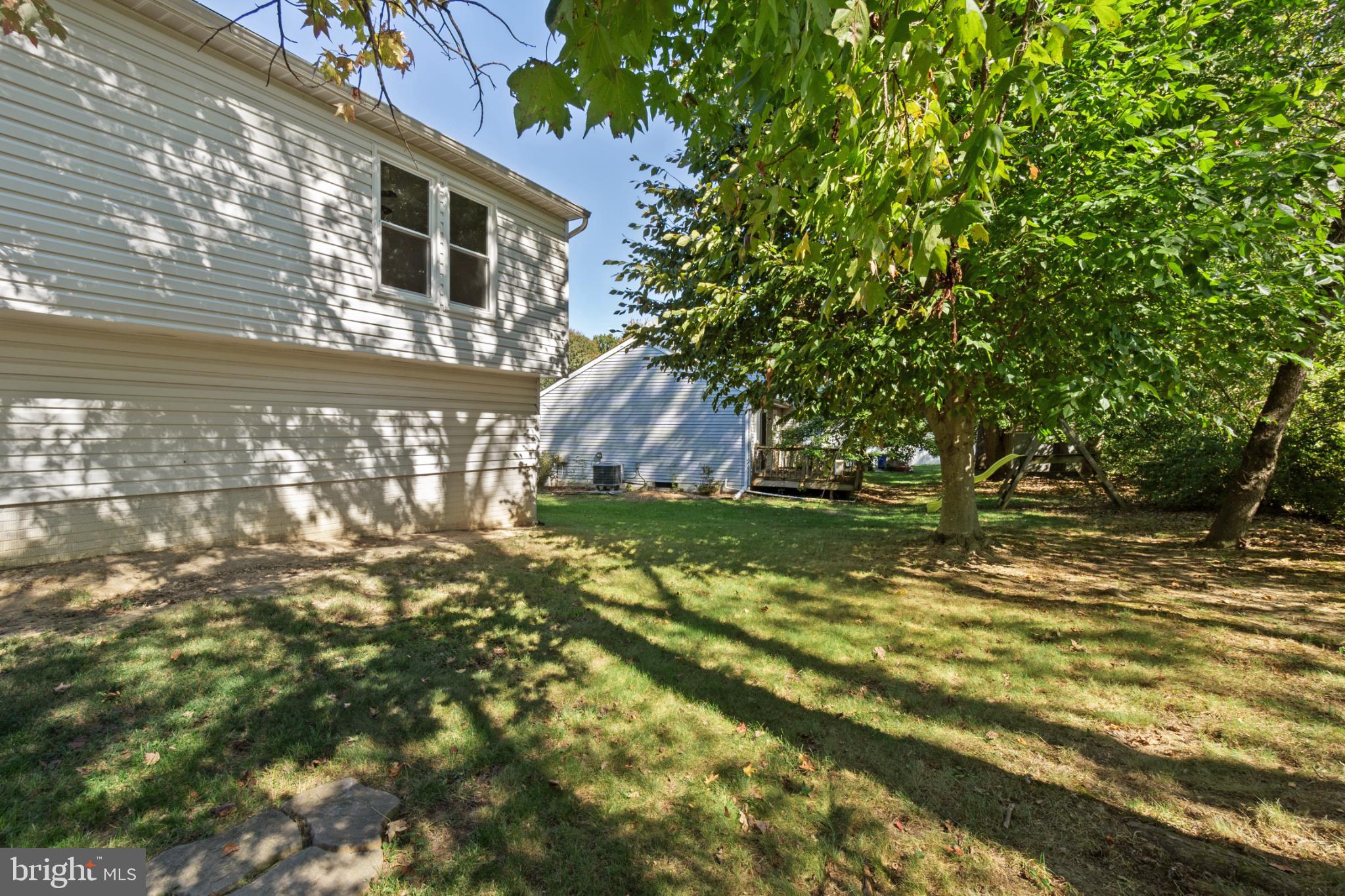 9079 Manorwood Road Laurel, MD 20723 - Photo 35 of 35 a backyard of a house with lots of green space