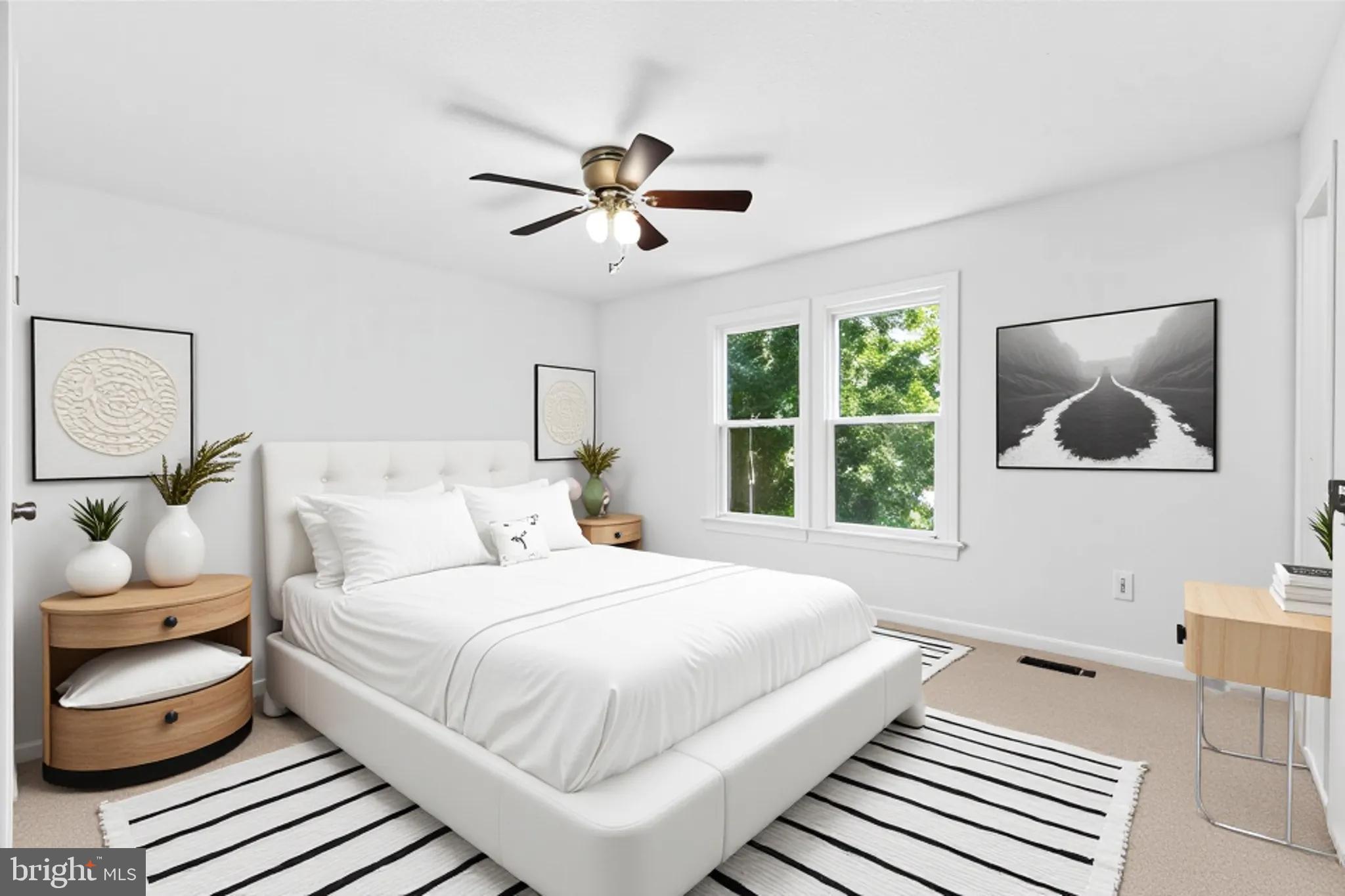 9079 Manorwood Road Laurel, MD 20723 - Photo 10 of 35 a bedroom with a bed and window