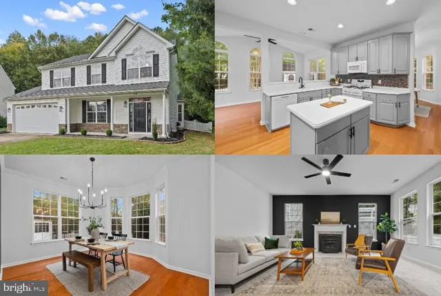 a view of a patio with couches table and chairs under an umbrella with wooden floor