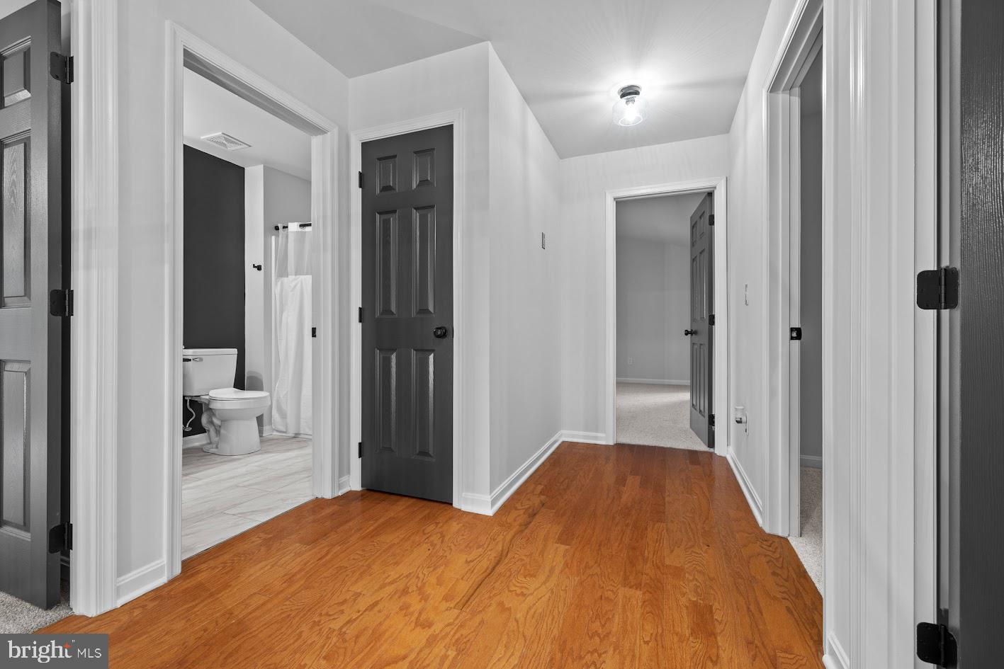 1111 Ruddy Duck Court Denton, MD 21629 - Photo 22 of 48 a bedroom with a bed and a view of bathroom