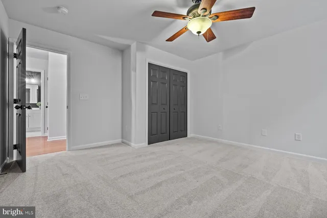 a view of a chandelier fan in a room