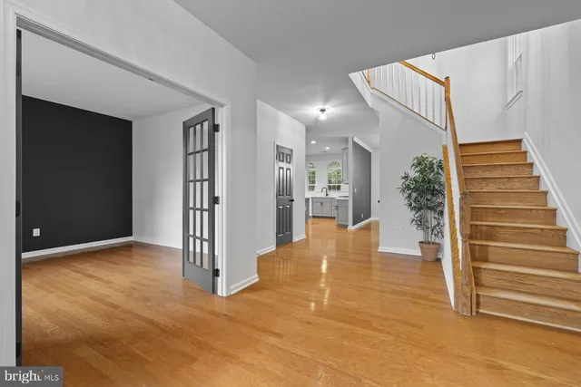 a view of livingroom and dining room with wooden floor