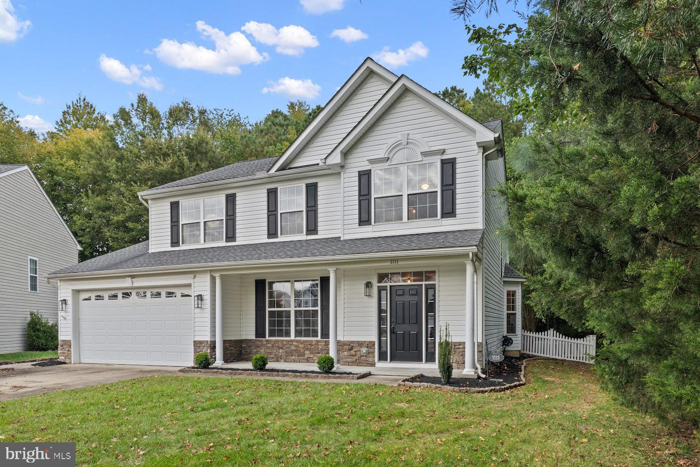 1111 Ruddy Duck Court Denton, MD 21629 - Photo 41 of 48 a front view of a house with a yard and trees