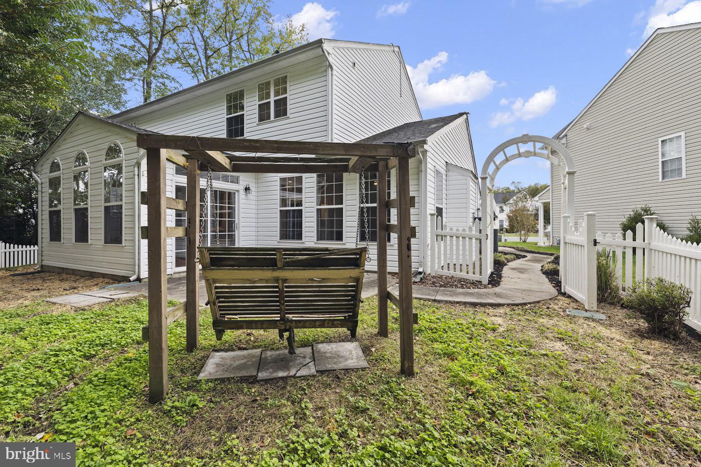 1111 Ruddy Duck Court Denton, MD 21629 - Photo 44 of 48 a front view of a house with a garden