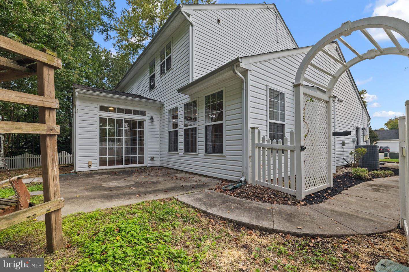 1111 Ruddy Duck Court Denton, MD 21629 - Photo 48 of 48 a view of a house with a small yard and wooden fence