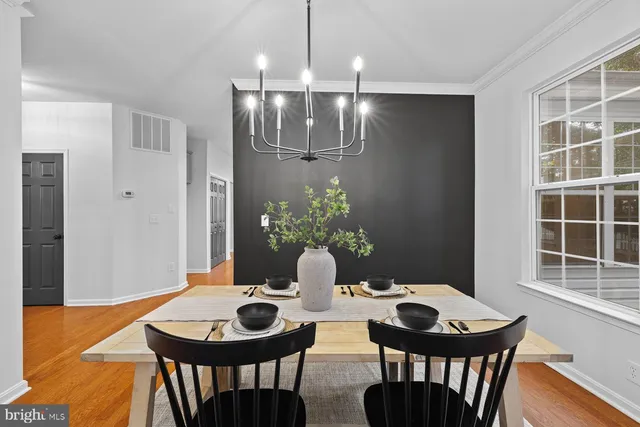 a view of a dining room with furniture and window