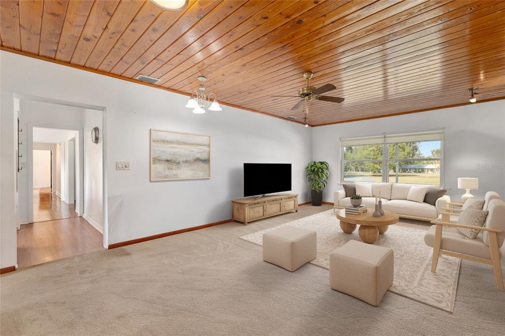 3430 Southwest 27th Street Ocala, FL 34474 - Photo 24 of 53 a living room with furniture and a flat screen tv