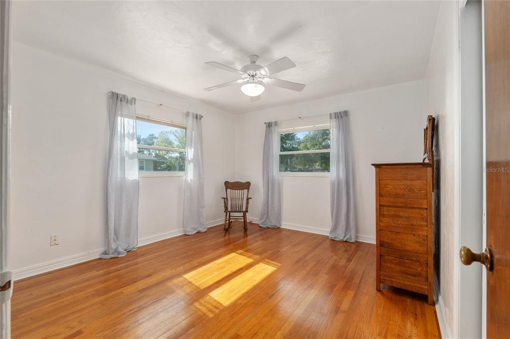 3430 Southwest 27th Street Ocala, FL 34474 - Photo 29 of 53 an empty room with wooden floor closet and windows