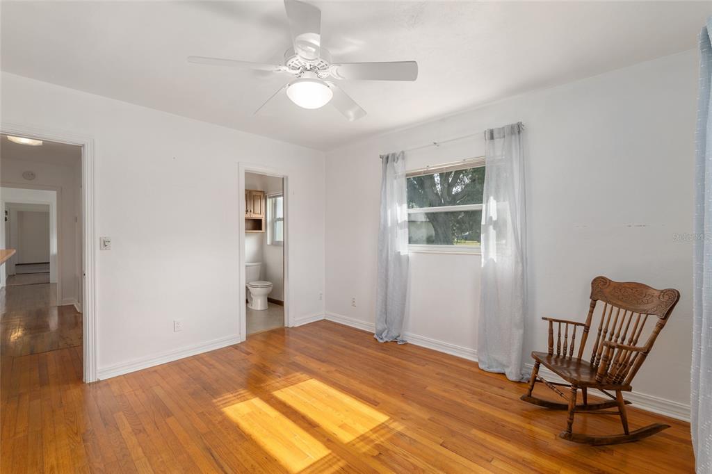 3430 Southwest 27th Street Ocala, FL 34474 - Photo 31 of 53 a bedroom with a bed and a chair