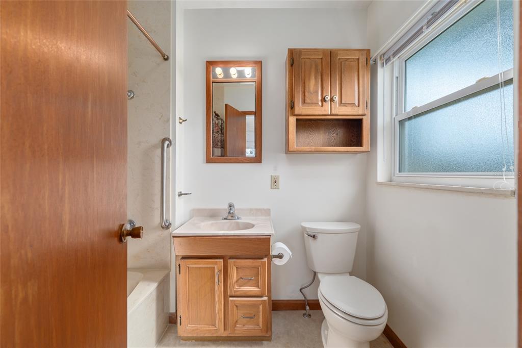 3430 Southwest 27th Street Ocala, FL 34474 - Photo 32 of 53 a bathroom with a toilet sink and mirror
