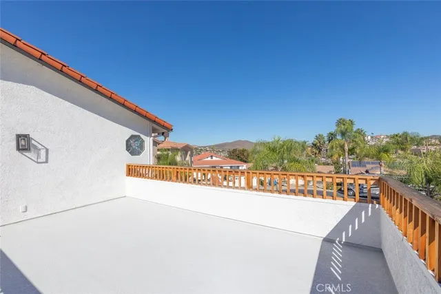a bedroom with a large bed and a large window