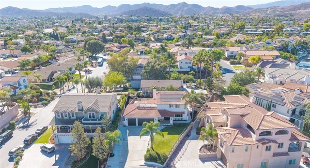 an aerial view of residential house with outdoor space and mountain view