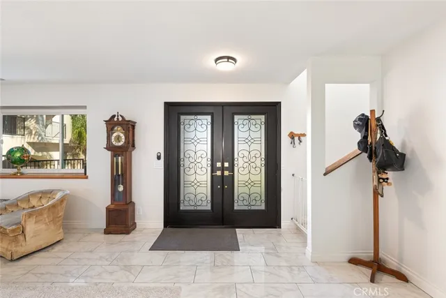 a bed room with furniture and a chandelier