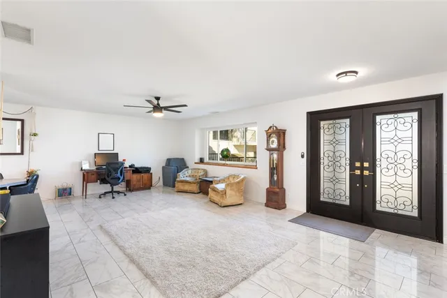 a living room with furniture and window