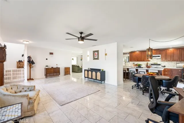 a large kitchen with stainless steel appliances lots of counter top space