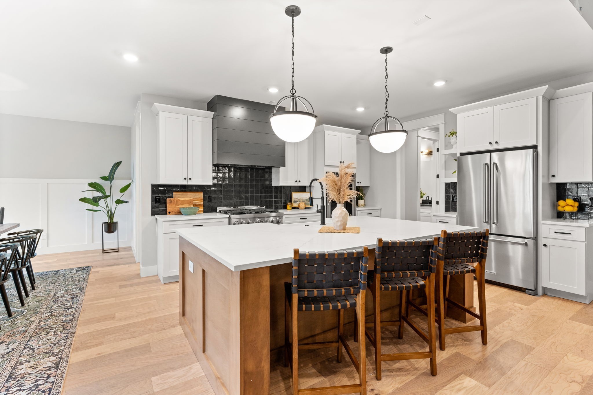 1017 Rucker Lane Murfreesboro, TN 37128 - Photo 16 of 61 a kitchen with stainless steel appliances kitchen island a table chairs and a refrigerator