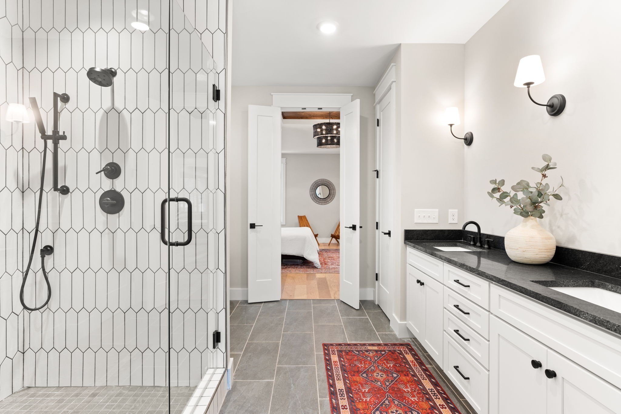 1017 Rucker Lane Murfreesboro, TN 37128 - Photo 28 of 61 a bathroom with a granite countertop shower a mirror and a shower