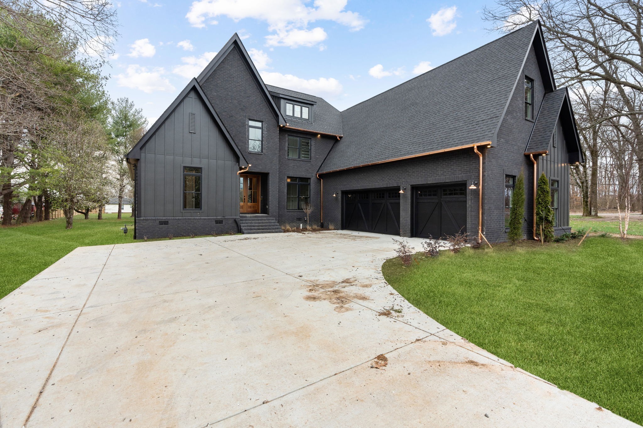 1017 Rucker Lane Murfreesboro, TN 37128 - Photo 3 of 61 a front view of a house with a yard and garage