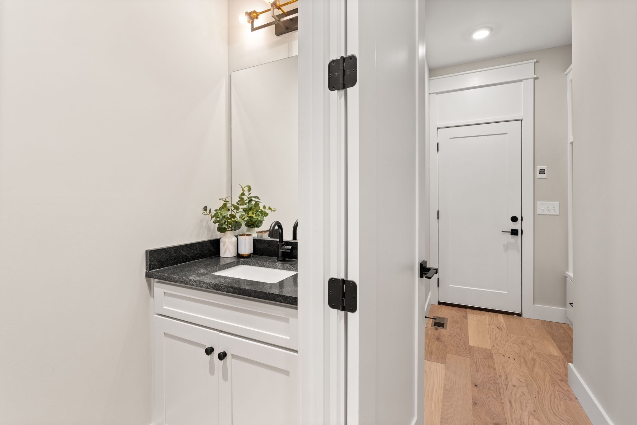 1017 Rucker Lane Murfreesboro, TN 37128 - Photo 36 of 61 a bathroom with a granite countertop sink a mirror and shower