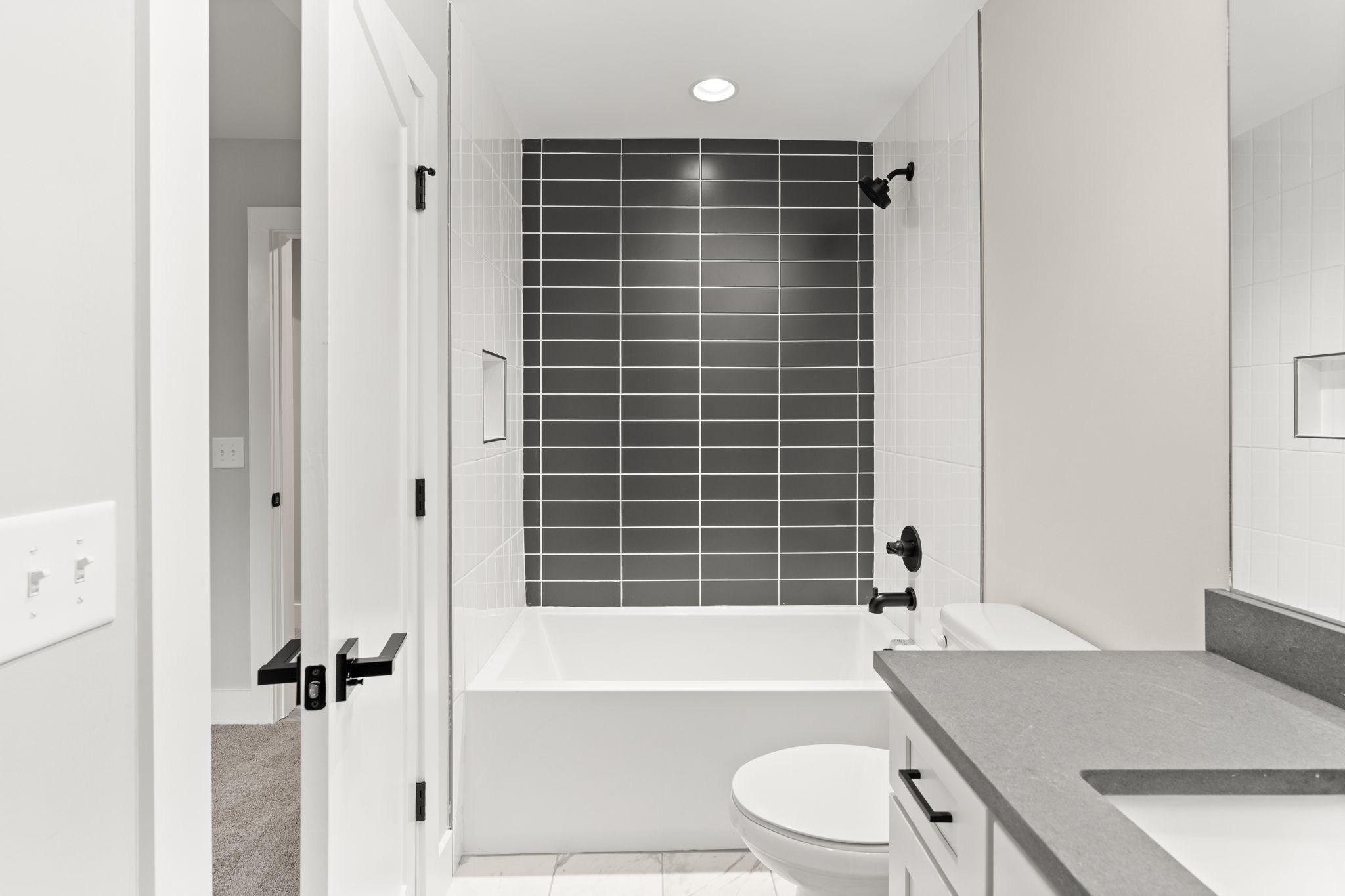 1017 Rucker Lane Murfreesboro, TN 37128 - Photo 45 of 61 a bathroom with a granite countertop bathtub toilet and sink