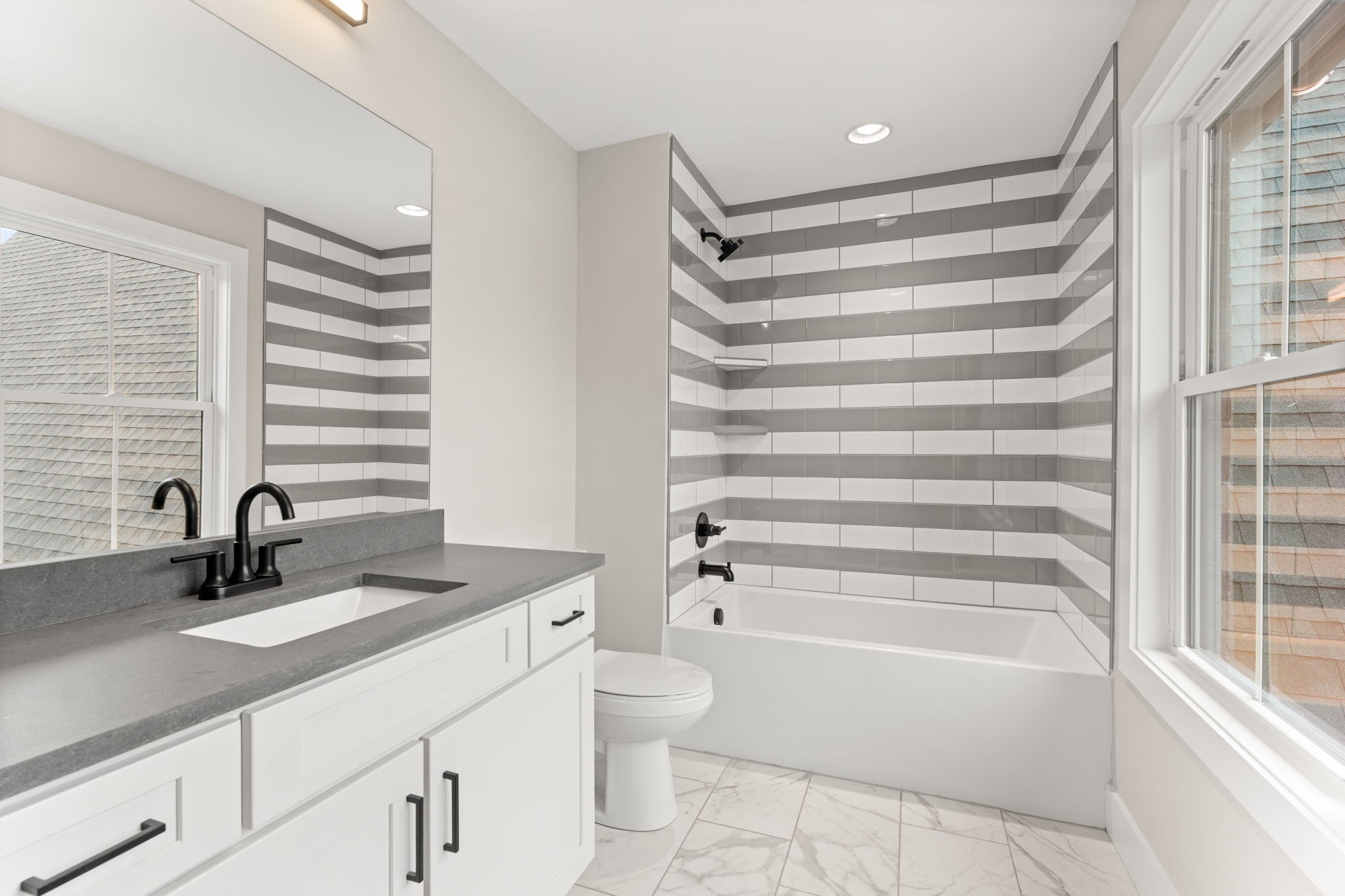 1017 Rucker Lane Murfreesboro, TN 37128 - Photo 49 of 61 a bathroom with a sink a toilet and a bathtub