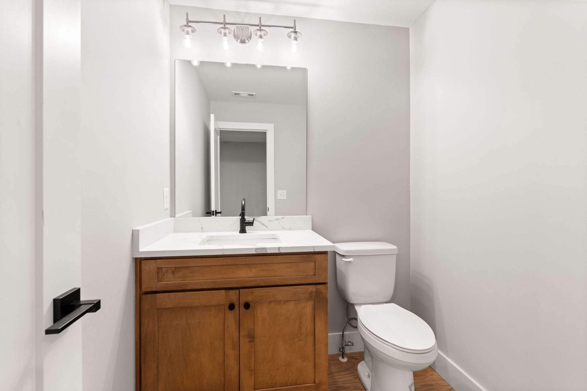 1017 Rucker Lane Murfreesboro, TN 37128 - Photo 55 of 61 a bathroom with a toilet a sink and mirror