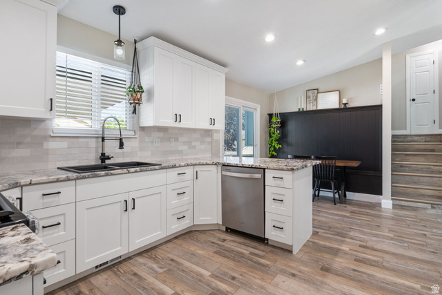 415 360 East Salem, UT 84653 - Photo 4 of 20 Modern kitchen featuring white shaker cabinetry, stone countertops, stainless steel dishwasher, wood-finish flooring, and a black double basin sink with a matte black faucet