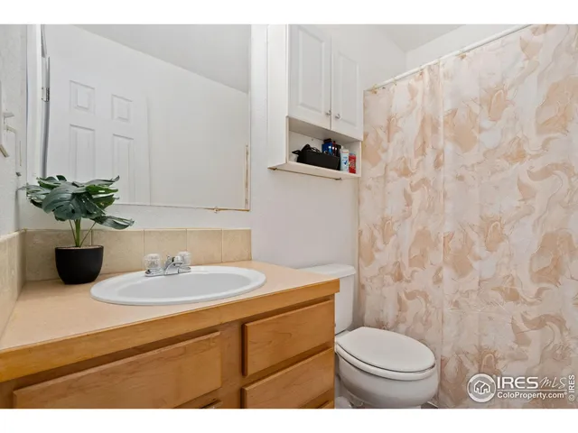 a living room with a furniture and a window