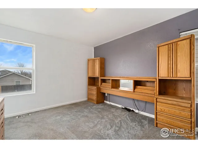 a bathroom with a toilet a sink and a mirror