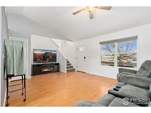 a bedroom with furniture and wooden floor
