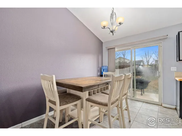 a kitchen with stainless steel appliances a sink cabinets and a window