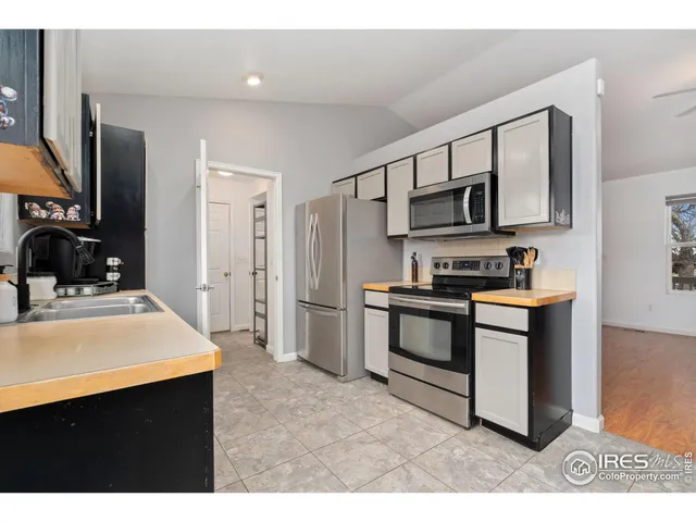 a bathroom with a sink double vanity and a shower