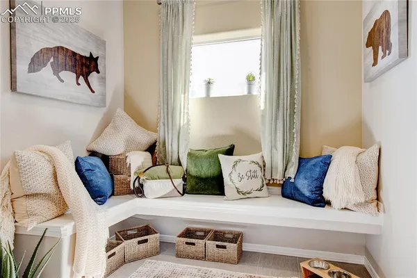 a bedroom with a bed and a painting on the wall