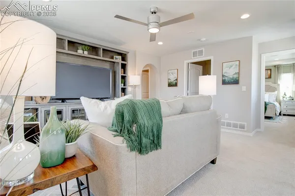 a living room with furniture and a fireplace