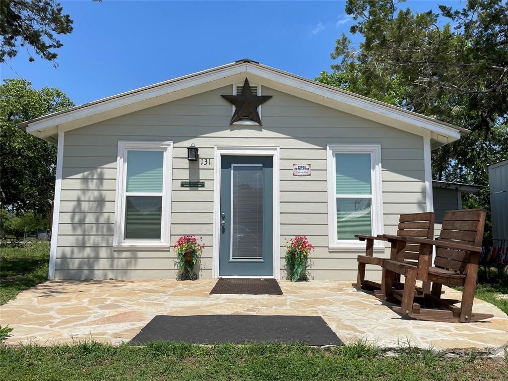 131 Alexander Drive, Unit 10 Tow, TX 78672 - Photo 1 of 11 a front view of a house with a yard