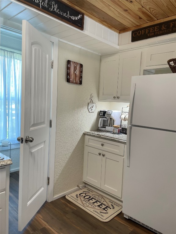 131 Alexander Drive, Unit 10 Tow, TX 78672 - Photo 11 of 11 a kitchen with a refrigerator and a stove
