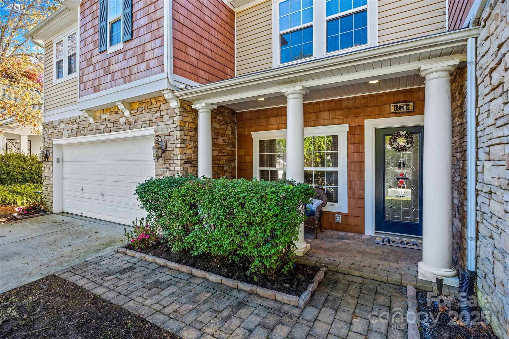 a front view of a building with garden