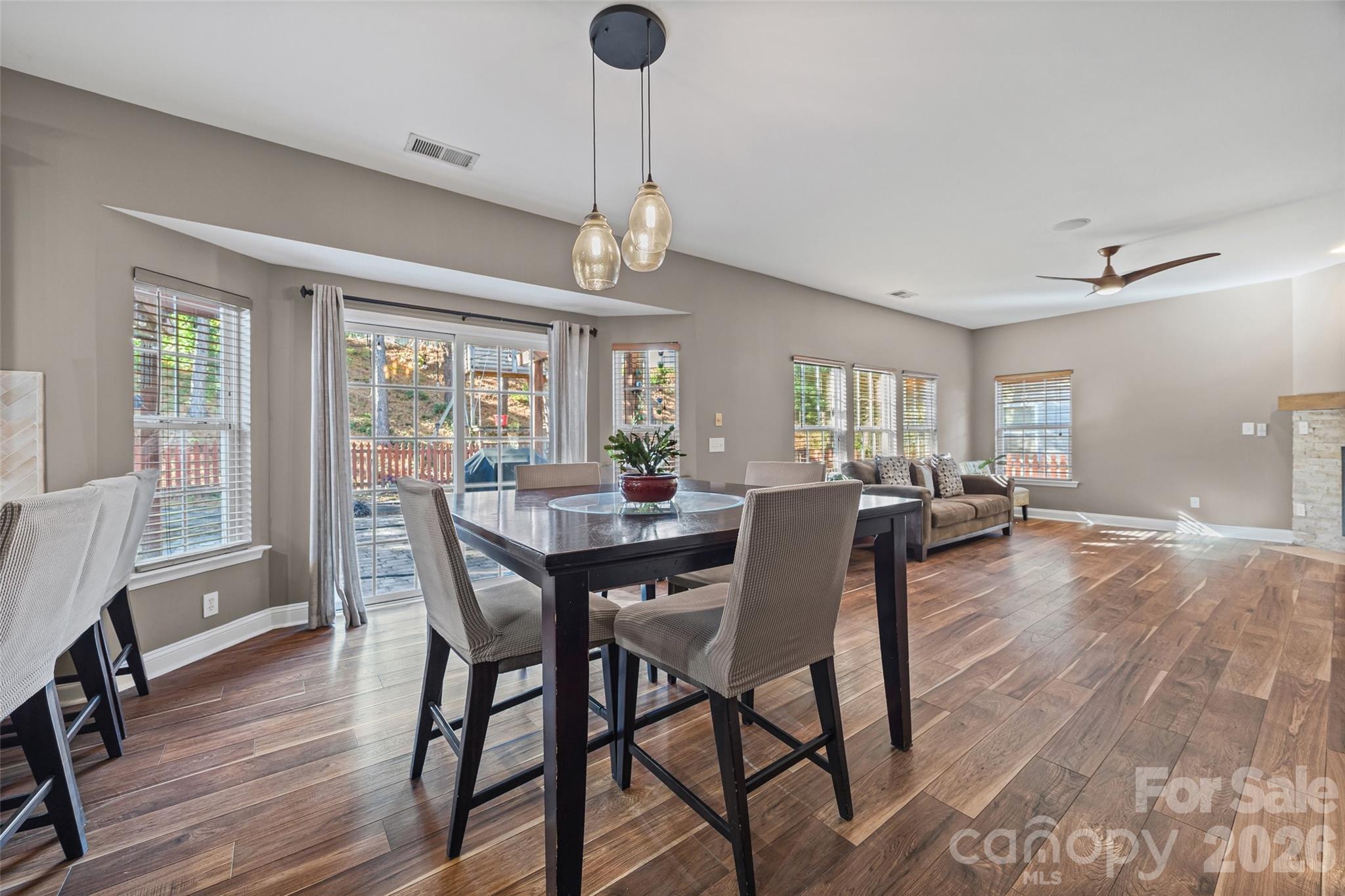 240 Loch Stone Street Fort Mill, SC 29715 - Photo 14 of 45 a view of a dining room with furniture window and wooden floor
