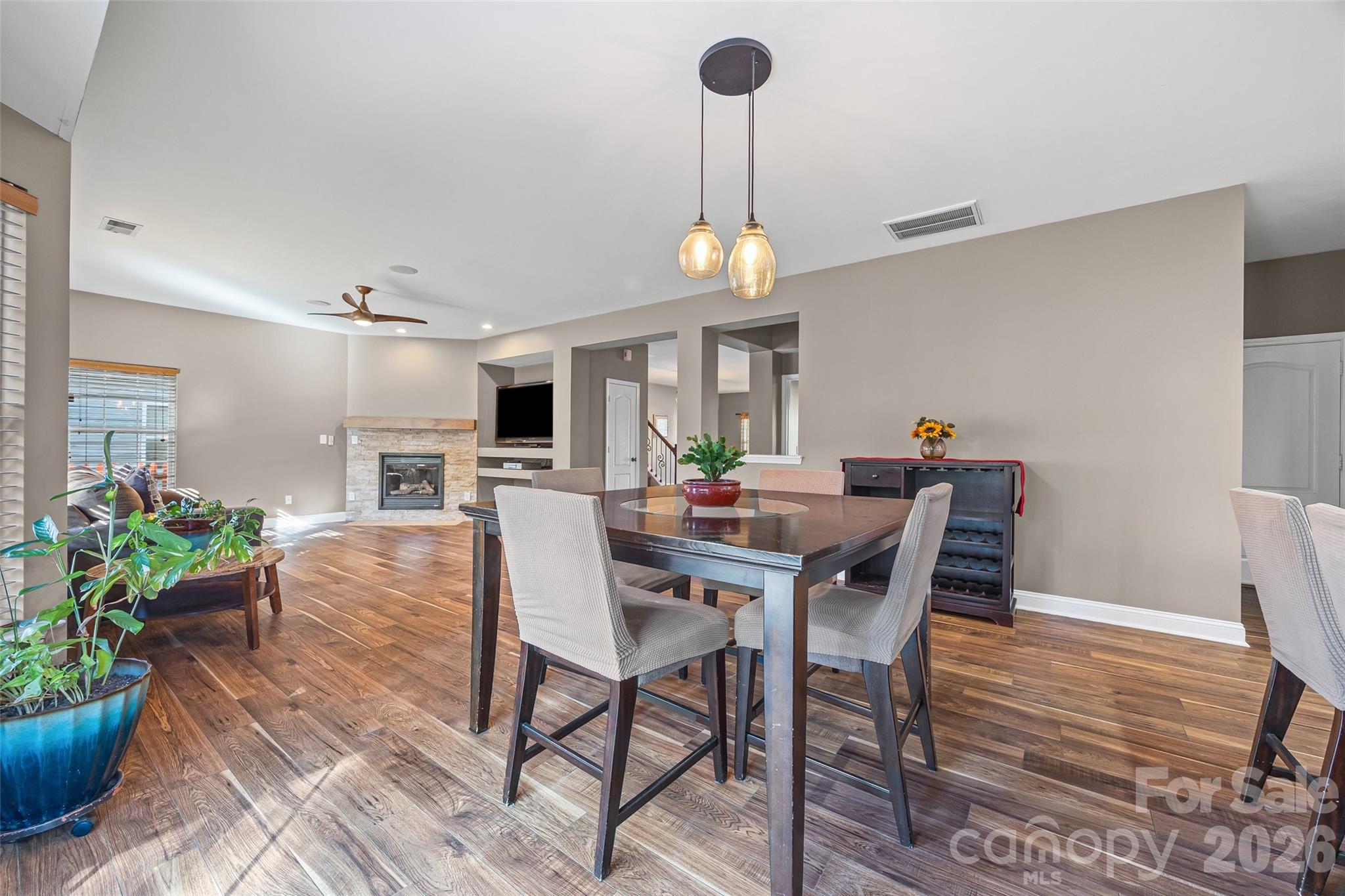 240 Loch Stone Street Fort Mill, SC 29715 - Photo 15 of 45 a view of a dining room with furniture window and wooden floor